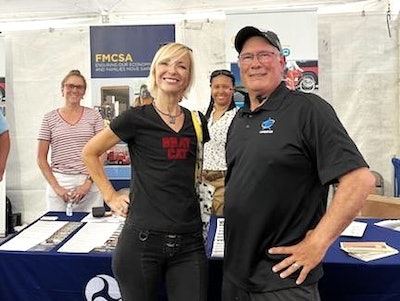 Gary Buchs and BratCat Express owner-operator Brita Nowak with FMCSA reps at truck show