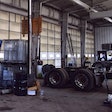 Photo of parts, trucks in fleet garage